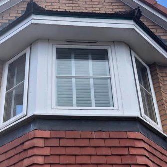 Bay window with bright white frames after