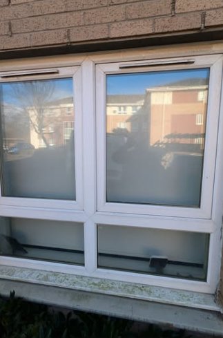 Ground-floor windows with dirty sills before